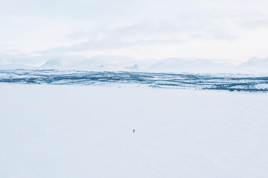 Abisko: Lake Torneträsk Arctic Ice Fishing Trip - Warm clothing before you reach the ice