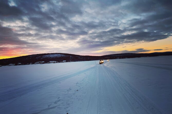 Day tour with snowmobile in Kiruna 10:30 am - Forest trails, frozen lakes, and open views