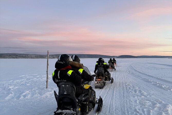 Day tour with snowmobile in Kiruna 10:30 am - Guides, instruction, and safety