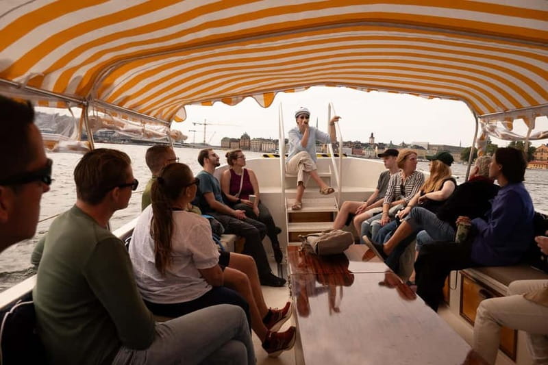Stockholm: Guided City Sightseeing Open Electric Boat Tour - Meeting the blue boat by Stockholm Palace